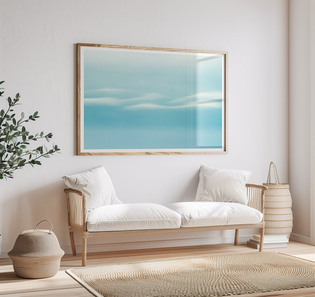 Clouds No 2 - Fine art print by Cattie Coyle Photography above couch. © 2018, all rights reserved.