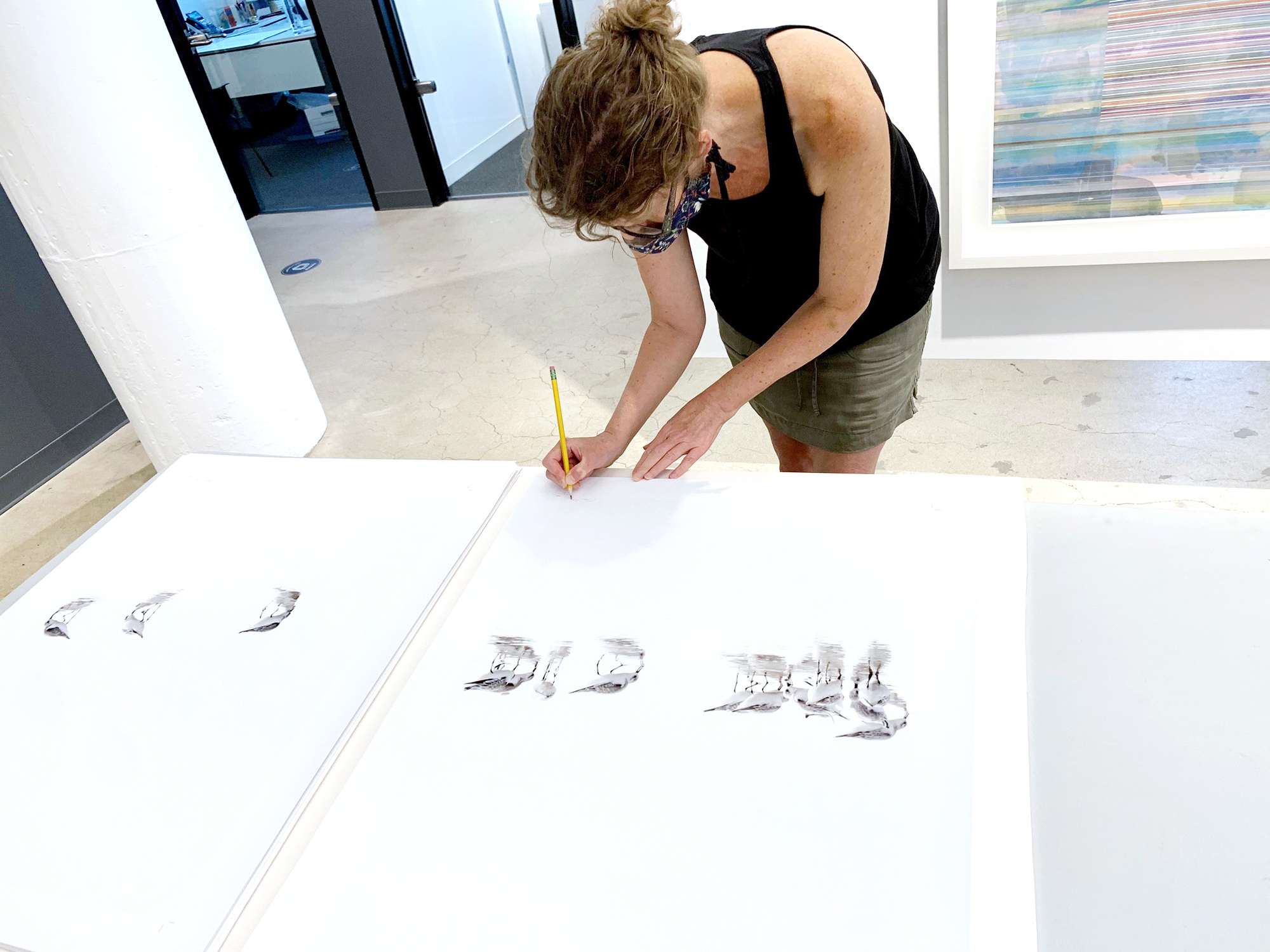 Cattie Coyle signing Sandpipers on the beach art prints for Chatham Bars Inn