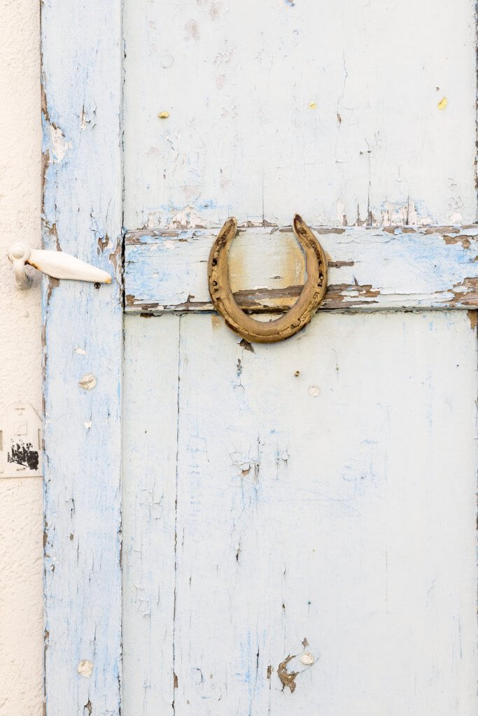 Horse shoe and blue shutter in le Suquet, Old Town Cannes, France, by Cattie Coyle Photography. © 2019, all rights reserved.