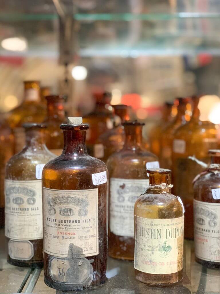 Old glass bottles at L'usine Centre D'Antiquite Brocante, Menton, France, by Cattie Coyle Photography. © 2019, all rights reserved.