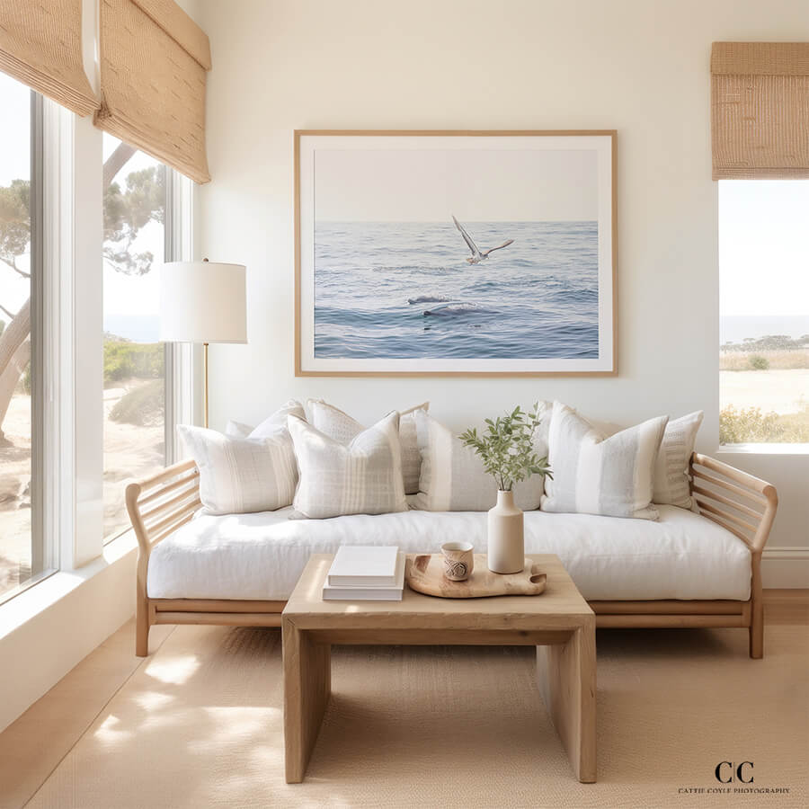 Dolphin art print by Cattie Coyle Photography in beach house living room. © 2023, all rights reserved.