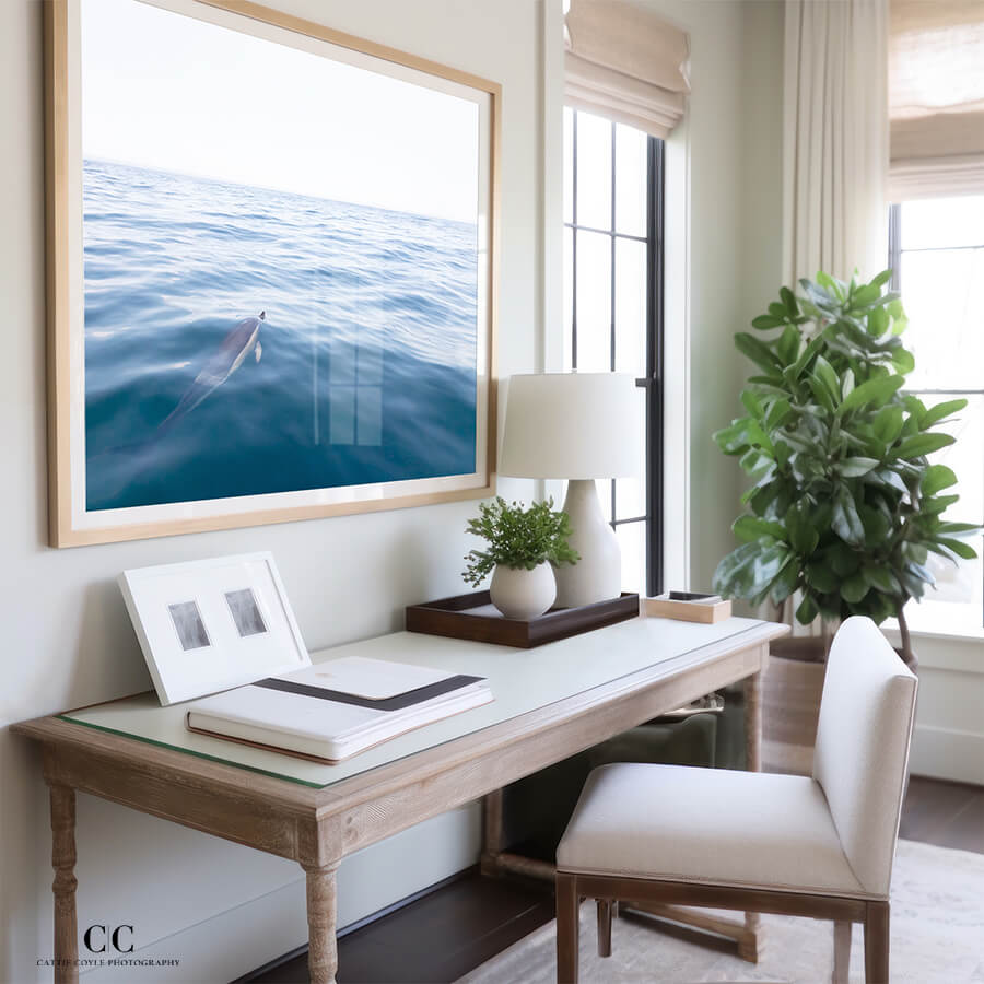 The Vast Ocean - Fine art dolphin print by Cattie Coyle Photography in home office. © 2023, all rights reserved.