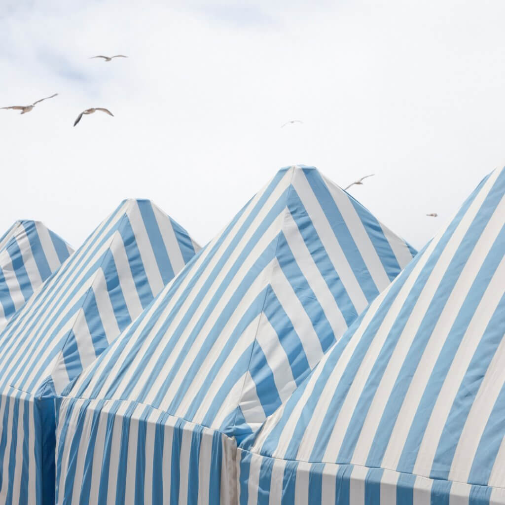 Gulls and beach cabanas, Foz do Douro, Porto, Portugal by Cattie Coyle Photography. © 2024, all rights reserved.