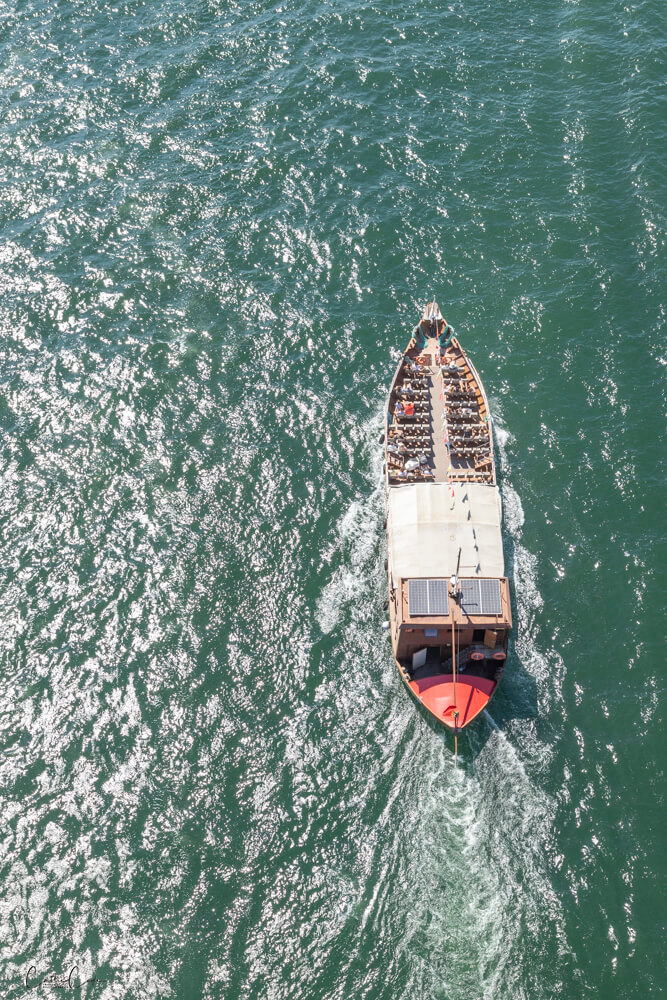 Watching boats from the Luís I Bridge, Porto, Portugal by Cattie Coyle Photography. © 2024, all rights reserved.