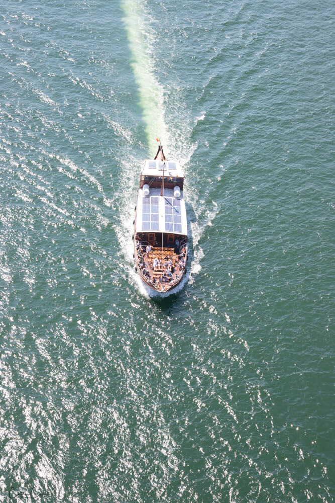 Watching boats from the Luís I Bridge, Porto, Portugal by Cattie Coyle Photography. © 2024, all rights reserved.